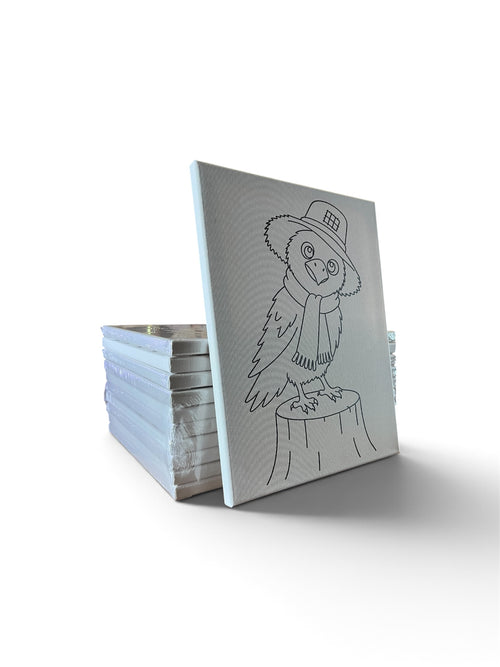 Stack of pre-traced canvases with an owl design displayed in front
