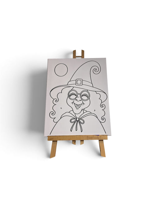 Front view of a pre-traced witch canvas displayed on an easel; easel not included